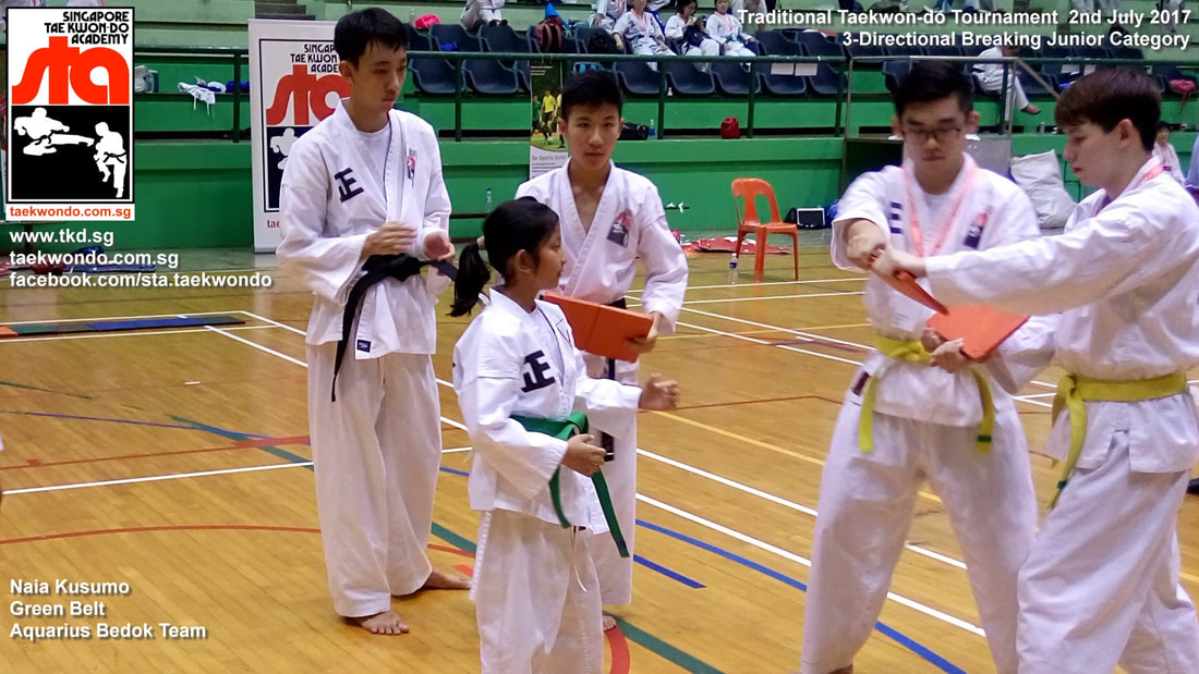 Naia Kusumo Green Belt Breaking Board Powerful Kick Competition Tournament Kids Children Self Defence Martial Arts Aquarius Bedok Reservoir Tampines Club School Adrian Huan Senior Instructor Singapore Taekwon-do Academy HQ Traditional Taekwondo STA TKD SG